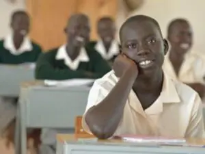 A group of students sitting at desks in a classroom.