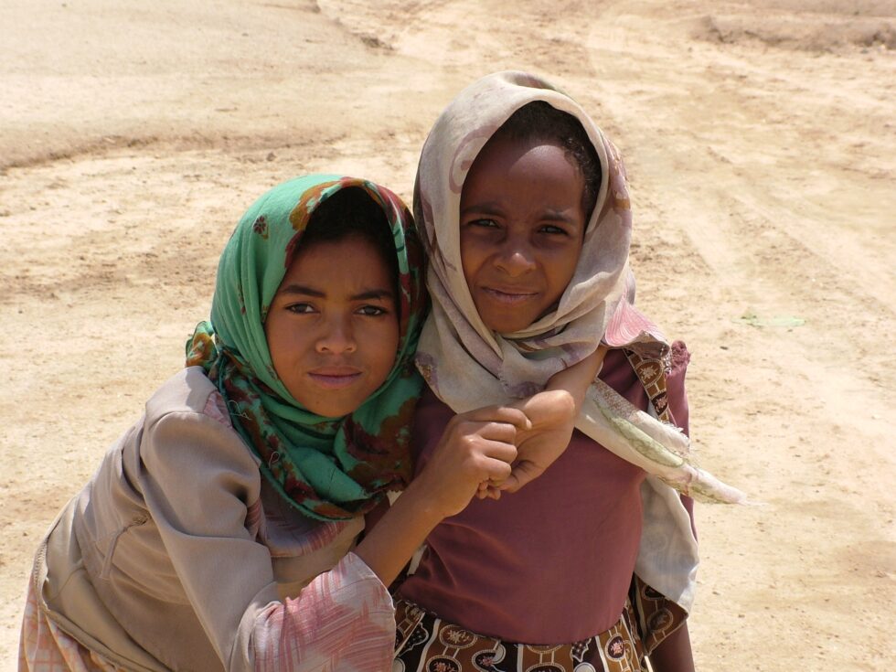 Photo of Two girls standing in the Desert