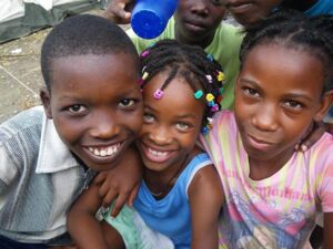 A group of children posing for the camera.