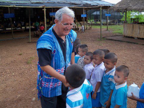 A person standing in front of children