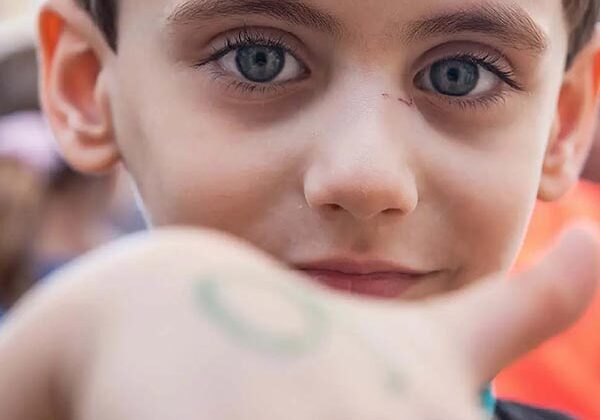 A close up of a child with blue eyes