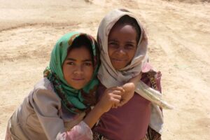 Photo of Two girls standing in the Desert