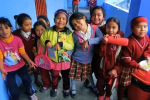Group of smiling children in school uniforms.